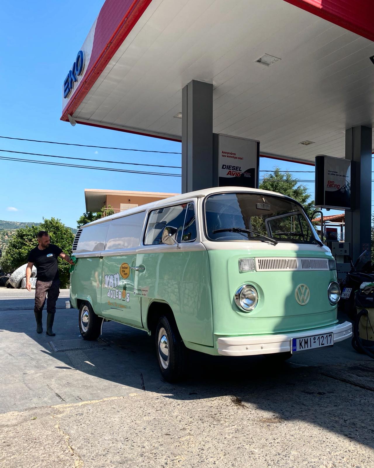 The mint Vandoleros Volkswagen van on the road